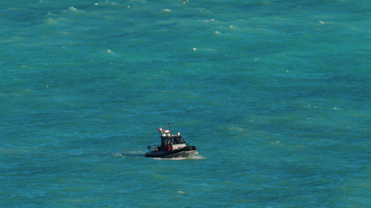 Nice, France - March 17, 2025: Small boat moving on the blue sea in daylight