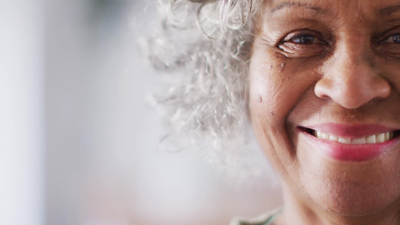 Portrait of happy senior african american woman looking at camera and smiling