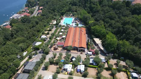 aerial shot of weekend glamping resort camp site near lake garda, italy