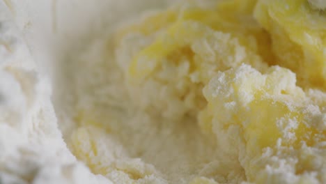 mixing flour and egg yolks with fork