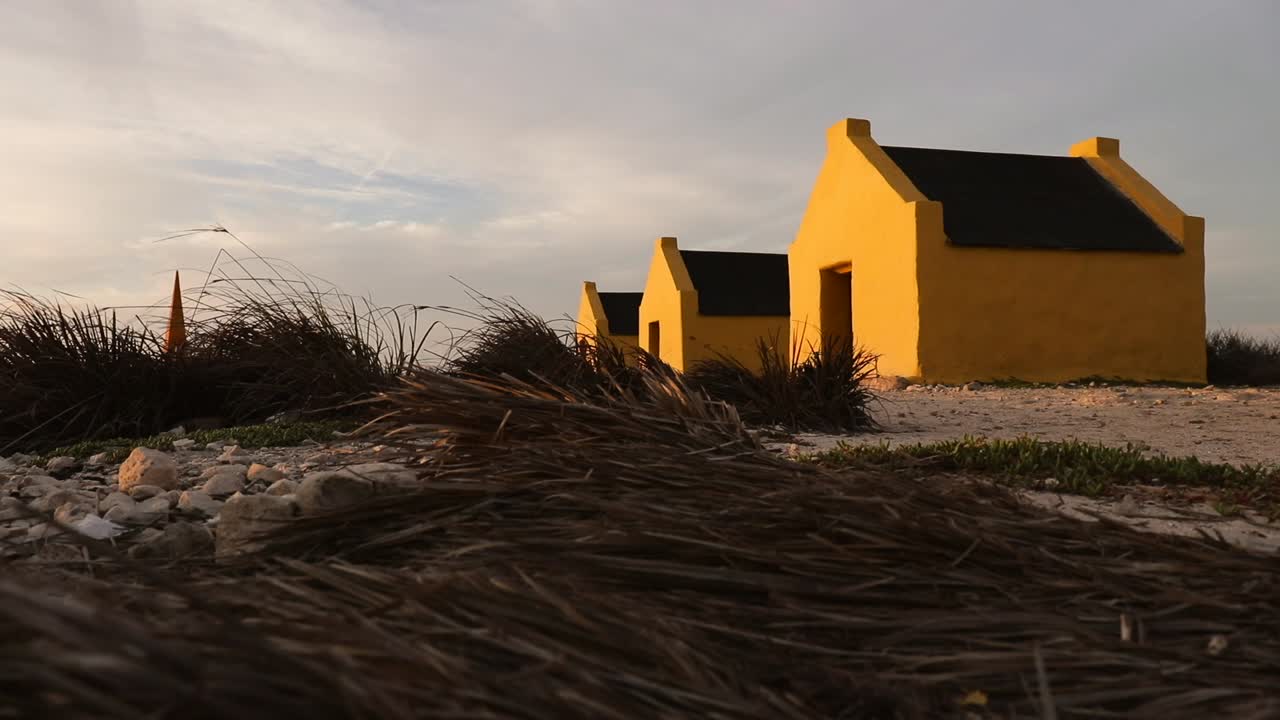 Yellow Beach Huts in Bonaire at Sunset
