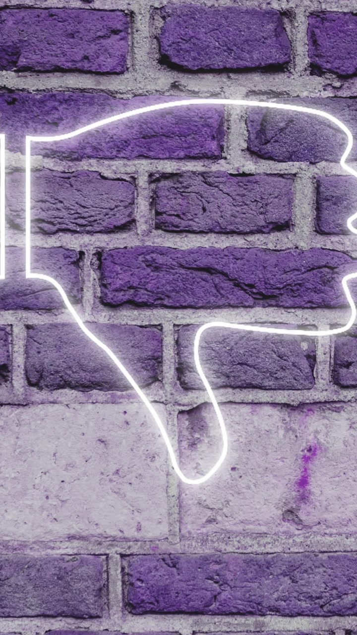 Insegna al neon pollice verso su muro di mattoni 4k