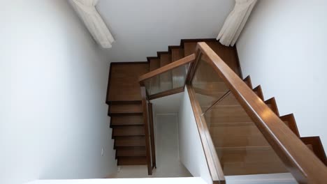 nice and clean shiny wooden stairway and white wall