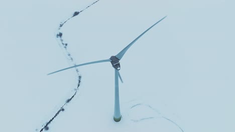 aerial view wind turbine blades spin and produce electricity for consumers