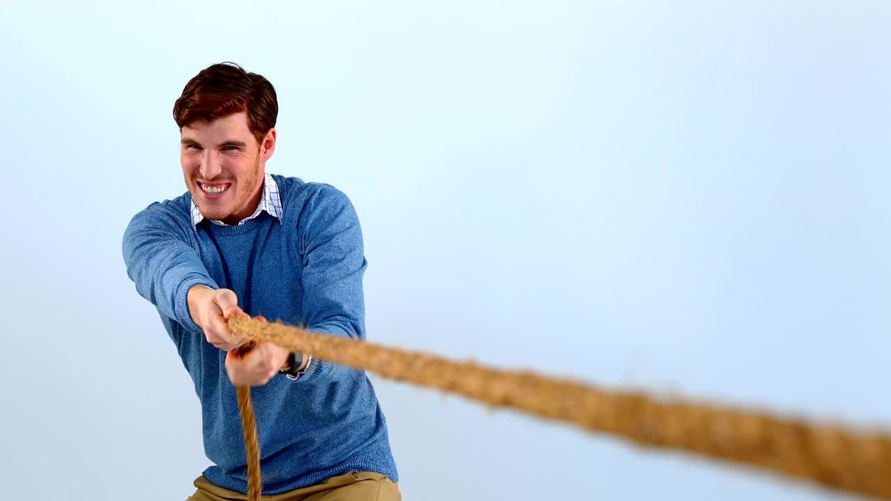 Man pulling a rope against white background 4k