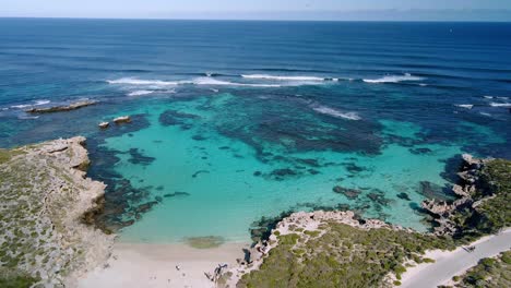 Aerial-view-of-Salmon-Bay,-Rottnest-Island,-Australia--reverse,-drone-shot