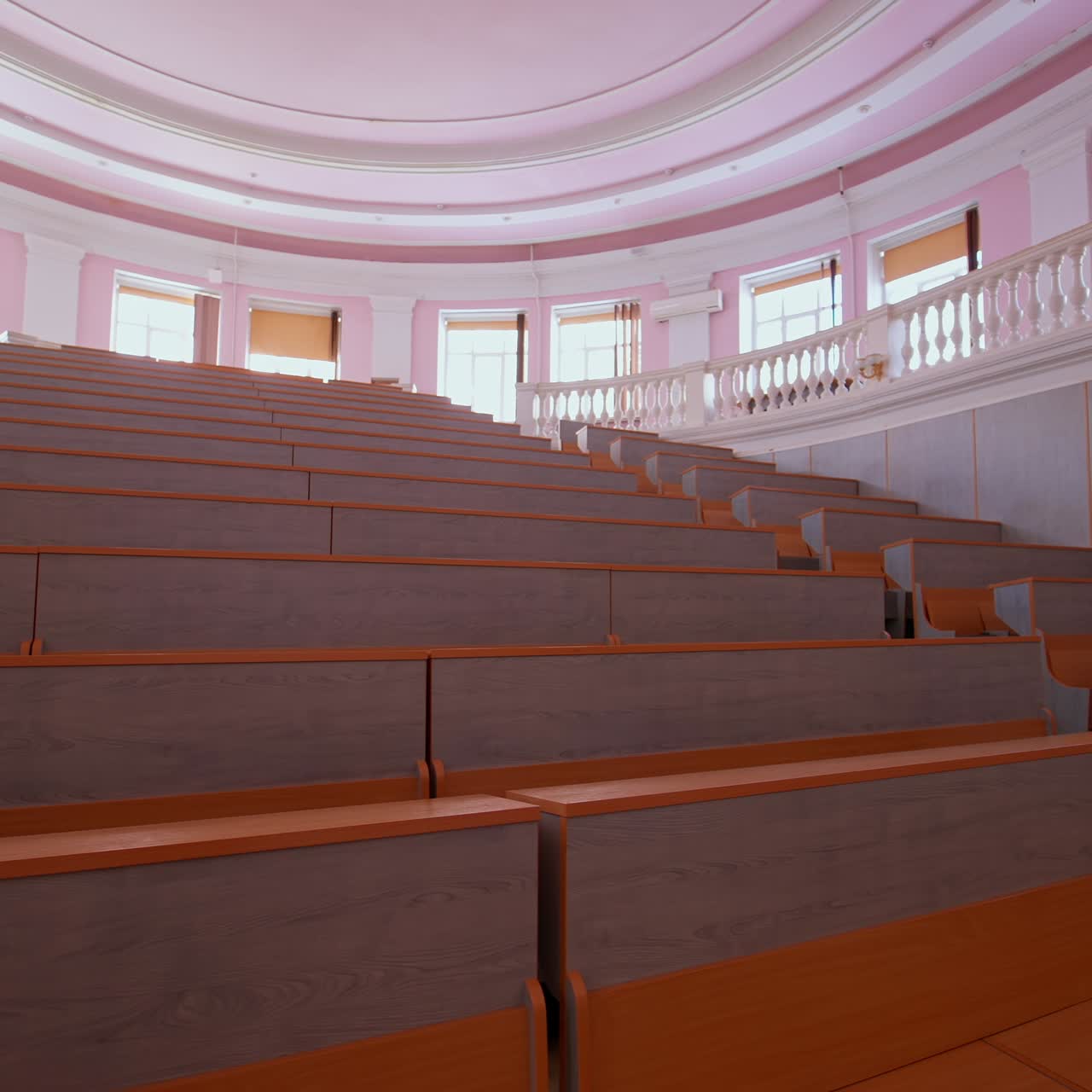 Lecture hall with nobody. Modern educational auditorium in the university. Interior of a large empty classroom during coronavirus pandemic
