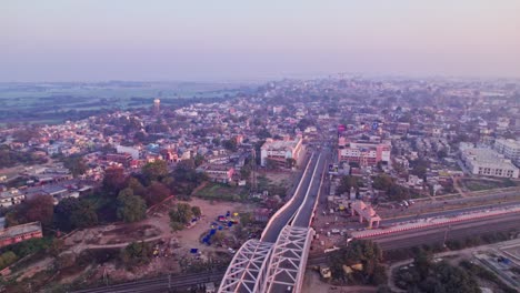 tedhi bazar railway overbridge with shree ramjanmbhumi temple or shree ram mandir with fog at day time, tilt up, drone shot, 4k.