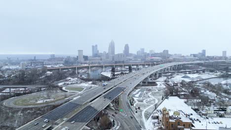 Static aerial shot of Downtown Cleveland, Ohio and the interstate in the winter.