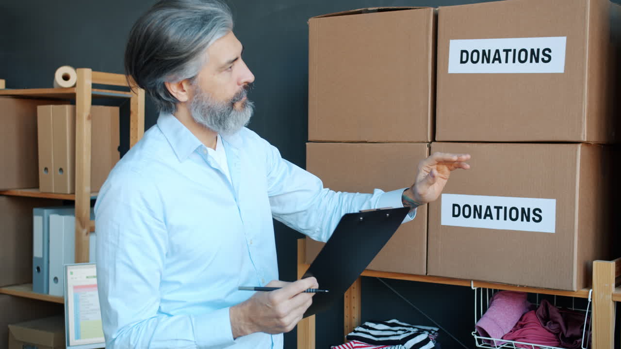 Man Taking Inventory of Donations
