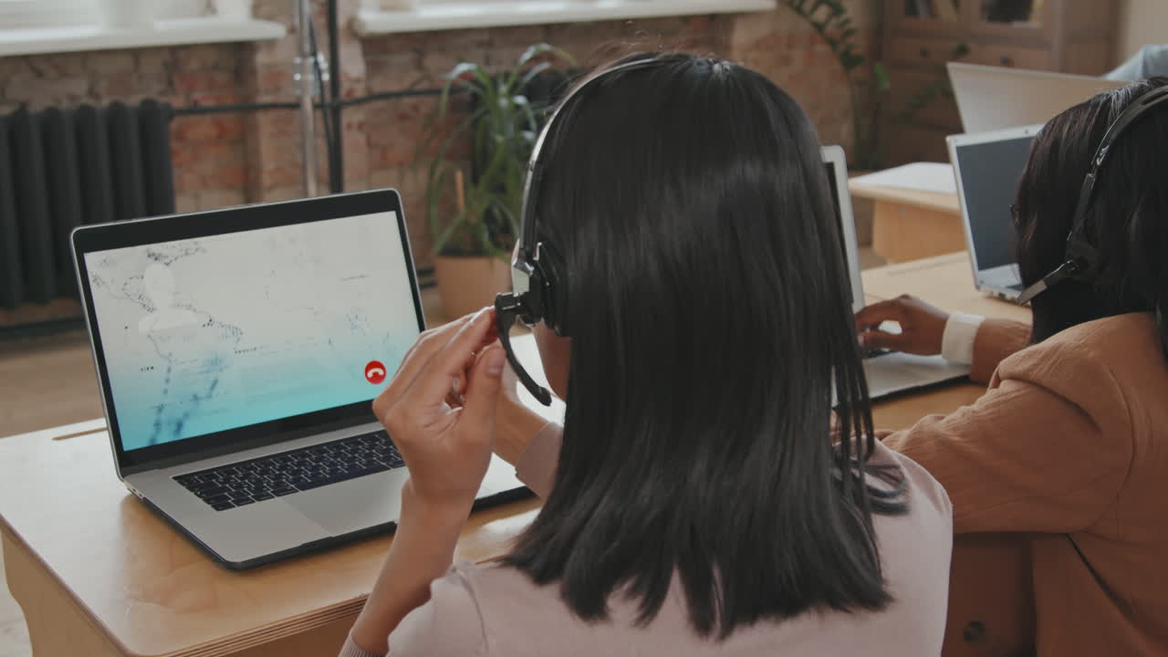 Female Call Center Operator Helping Customer