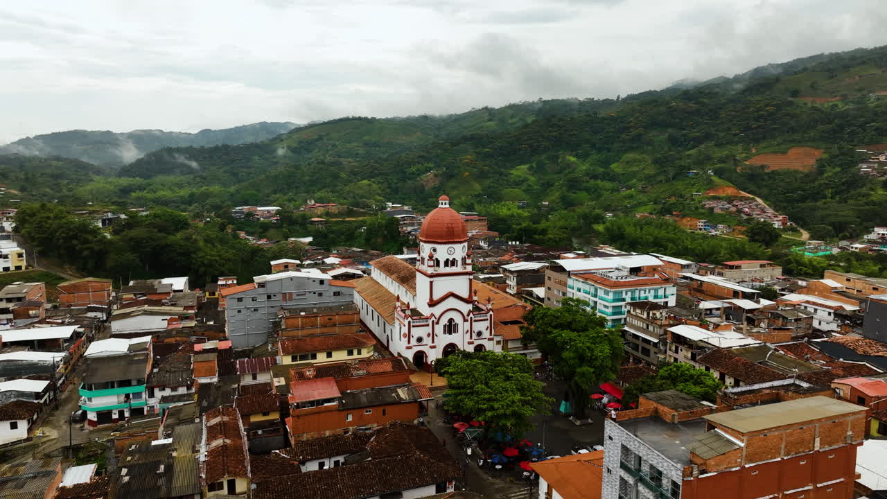 Aerial view around the St Raphael's Church in cloudy San Rafael, Antioquia, Colombia