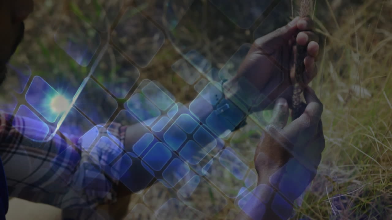 Man holding rosary beads checking smartwatch outdoors field, showing digital UI overlay for health