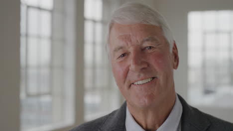 portrait-of-middle-aged-caucasian-man-laughing-enjoying-success-looking-at-camera-in-apartment-room-background-senior-male-retirement-slow-motion