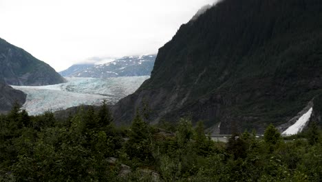 mendenhall glacier and nugget falls, in a cloudy day, alaska
