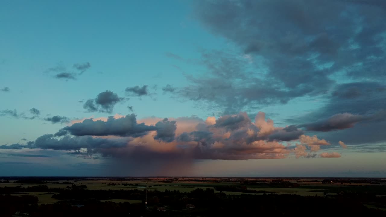 Storm Clouds With the Rain. Nature Environment Tornado Warned Supercell Storm Rolling Through the Plains. Crop Field After Rain and Storm Clouds in Background Rural Countryside. Aerial Dron Shot