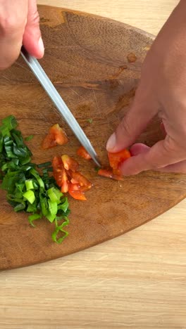 chopping tomatoes and green onions
