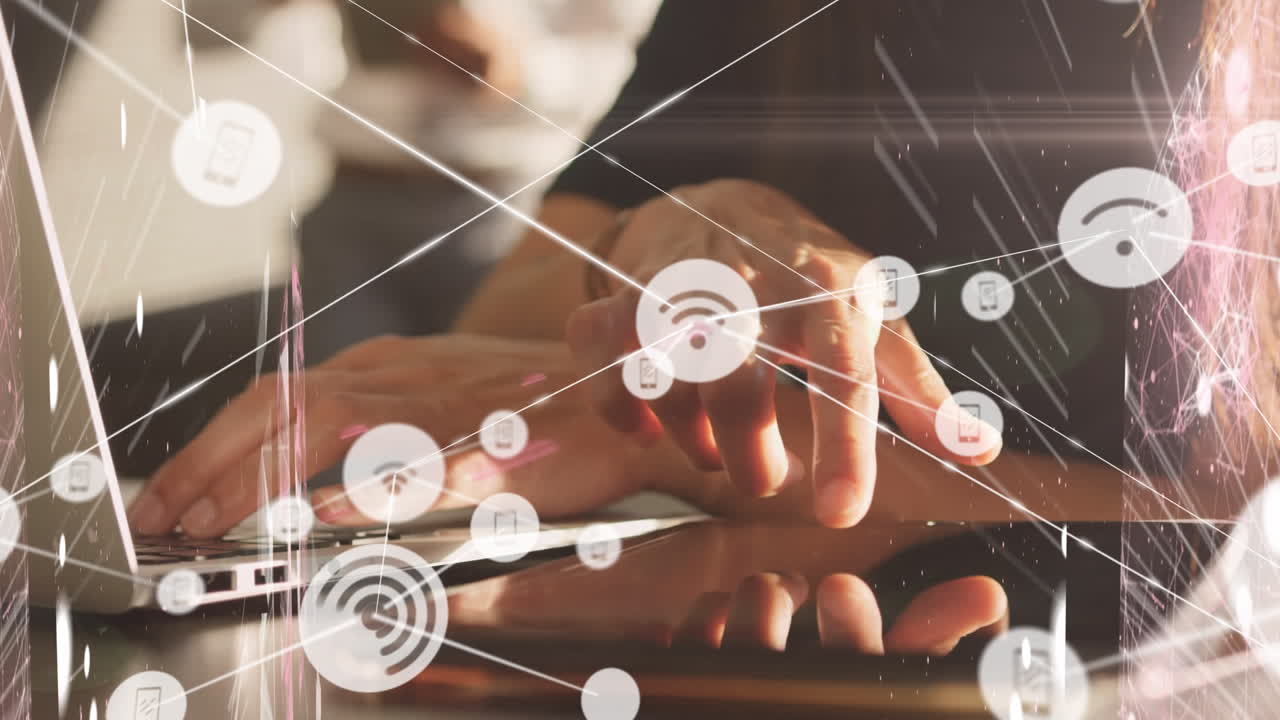 Animation of network of connections with media icons over caucasian businessman using laptop