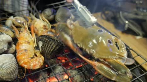 seafood grill on hot charcoal at bangkok seafood restaurant