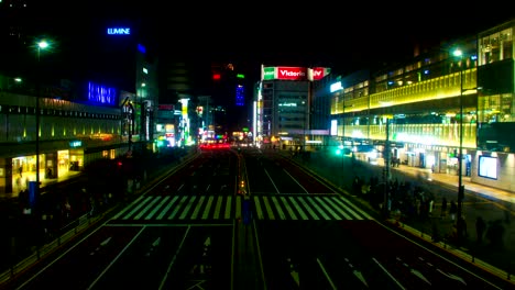 night lapse near station at shinjuku south side wide shot tilt down