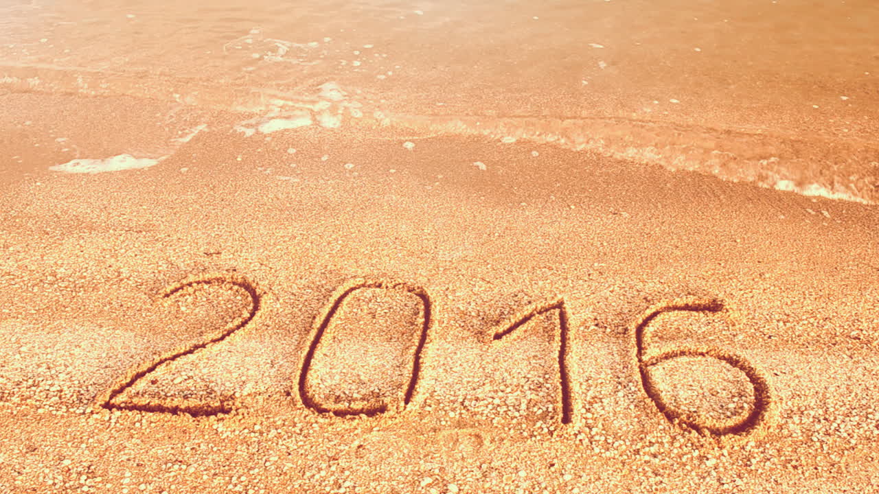 2016 on sand. The coming and expiring year