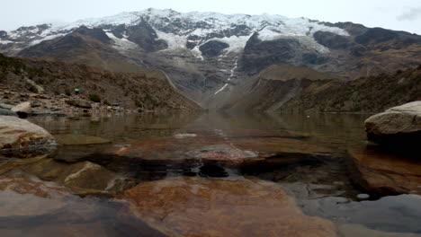 wide shot of lake humantay, cusco, peru