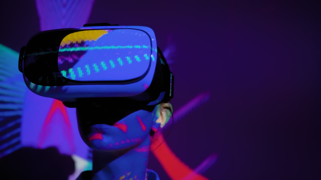 Young woman using virtual reality headset at dark interactive VR exhibition