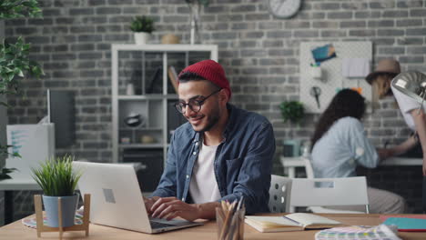 person working on laptop in modern office