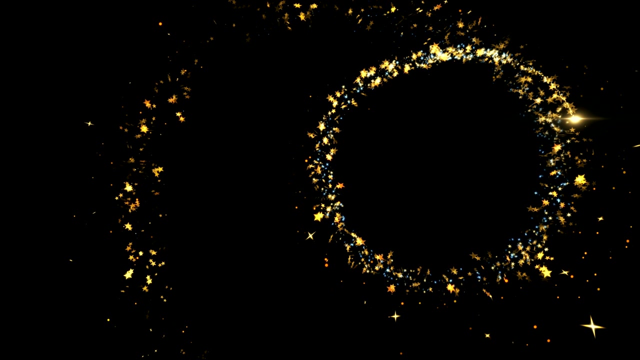 黒い背景に輝く、豪華なゴールドのグリッター星屑の軌跡。