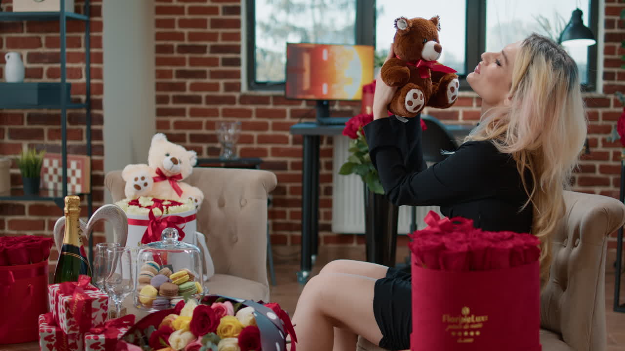 Woman celebrating with gifts and flowers