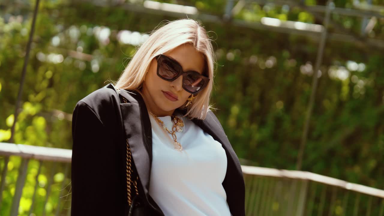 young attractive woman enjoying the sun in a city park