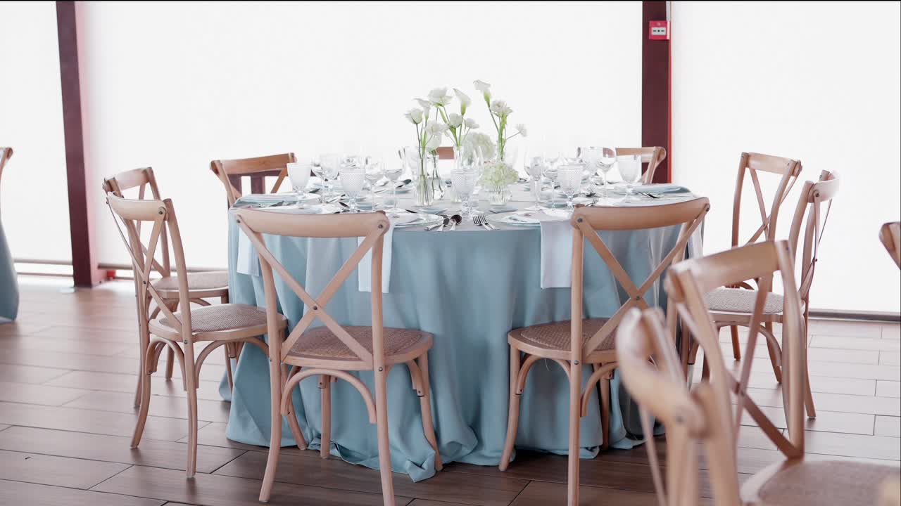 refined indoor table setup with floral centerpiece and soft natural tones