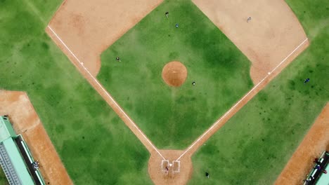 san pedro de macoris, dr - march 12, 2021 - top view of young people practicing baseball at stadium in san pedro, training session