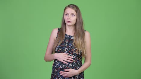 happy young beautiful pregnant woman talking