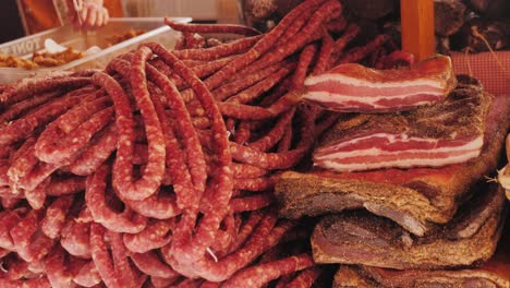 assortment of dried meats at a market