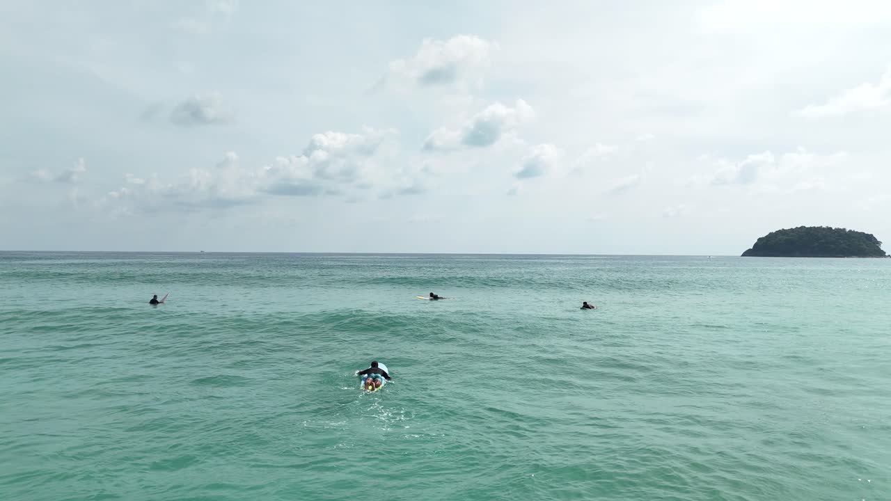 Surfers on a Tropical Island