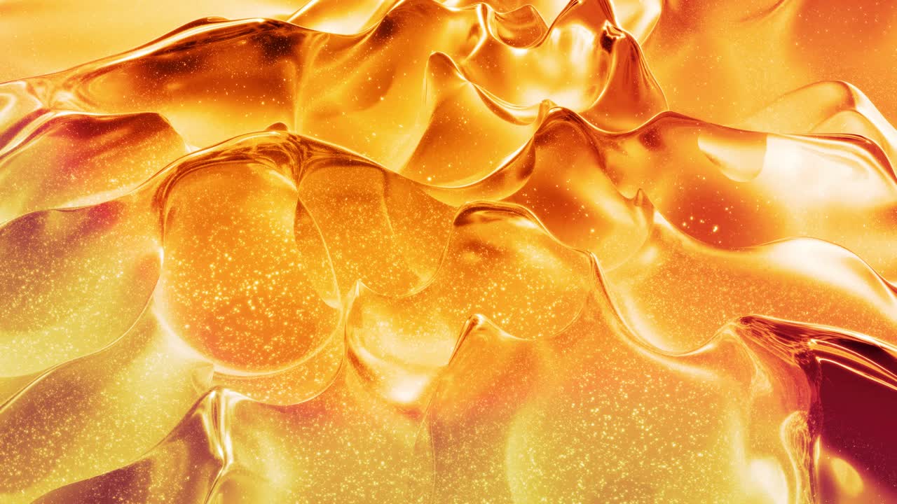 Looped abstract background with wavy sparkling golden liquid pattern on shiny glossy surface. Viscous yellow fluid like surface of gold foil or brilliant glass. Beautiful creative festive backdrop.