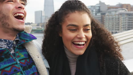 young tourist couple visiting london in winter