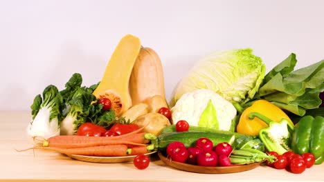 assorted vegetables displayed on a wooden surface