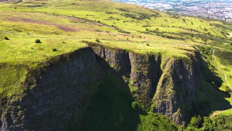 tilting aerial reveal shot of cavehill country park in belfast