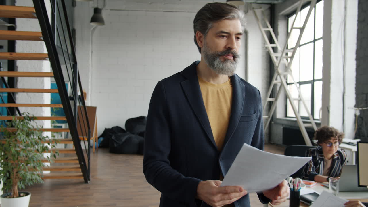 Businessman reviewing documents in a modern office