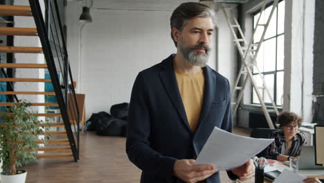 businessman reviewing documents in a modern office