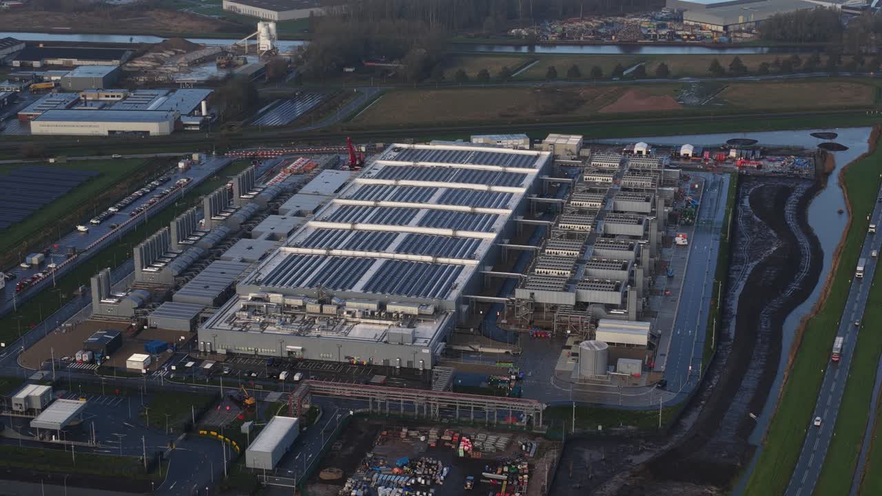Aerial drone video footage of a hyperscaler data center facility in Winschoten, Groningen, focusing on Artificial Intelligence, computing power, infrastructure, and renewable energy resources