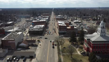 Downtown-Charlotte,-Michigan-skyline-with-drone-flying-forward