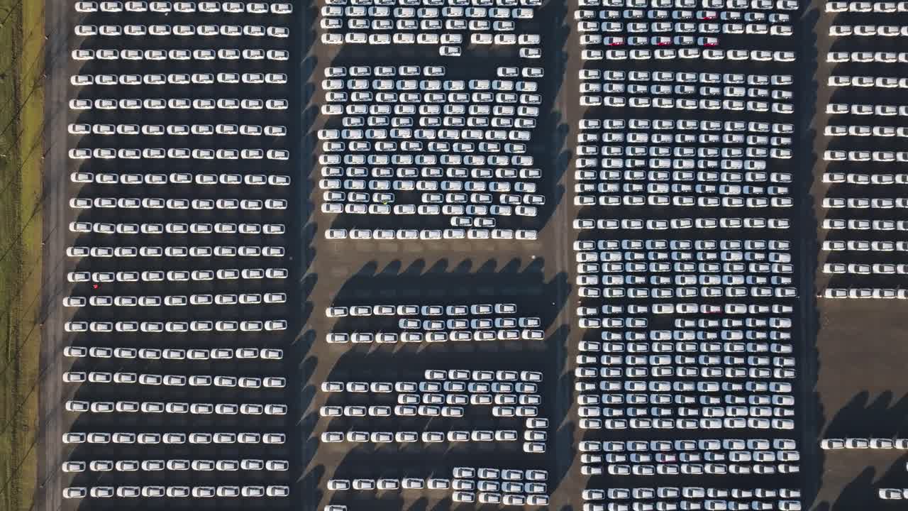 Aerial top down ascend over vast and full parking lot area