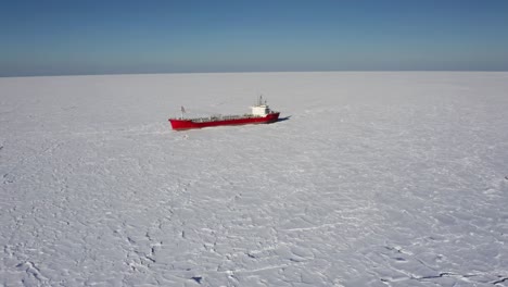 red tanker on frozen arctic ocean