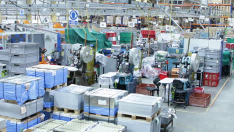 zoom-out-aerial-view-inside-a-production-factory-warehouse-without-labor-in-strike