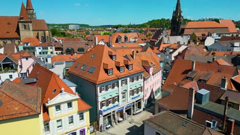 4k aerial drone video of the historic st. johannis church and st. gumbertus church in the old town area of downtown ansbach, germany