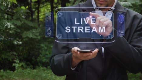 businessman uses hologram with text live stream