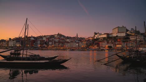 4k uhd cinemagraph of a beautiful evening in porto, portugal, the boats on the river are moving gently